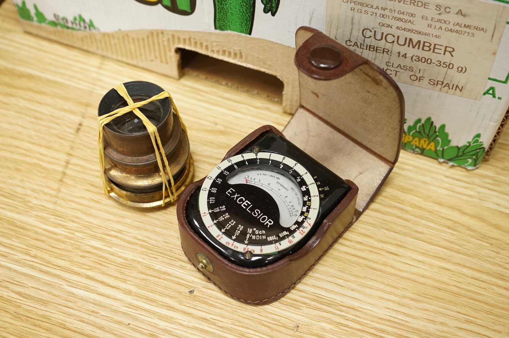 A Pentax P30 camera with Sunpak auto 2000DZ flash and instruction manual, together with an early 20th century mahogany cased quarter plate camera with accessories including lenses, a separate shutter unit, and four negat